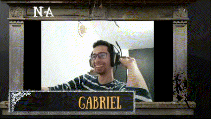 a man wearing headphones with the name gabriel on a sign