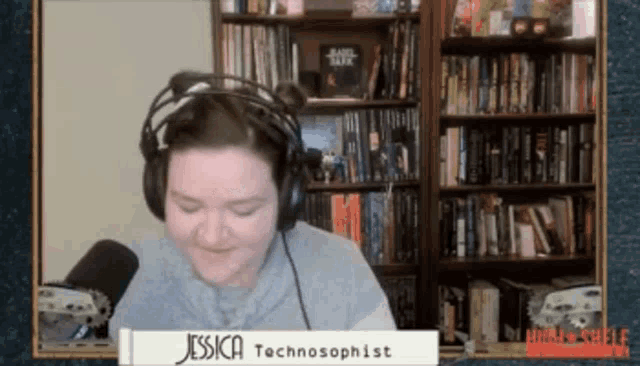 a woman wearing headphones and a sign that says jessica technosophist