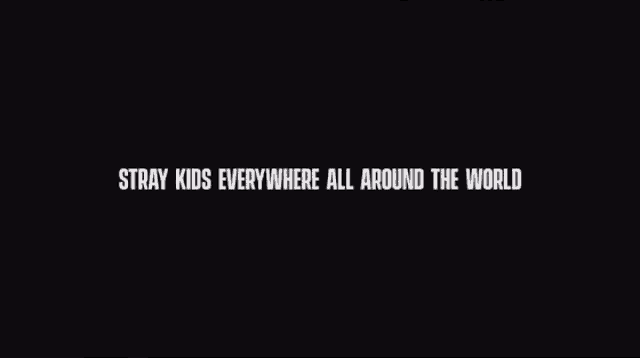 the words stray kids everywhere all around the world are on a black background .