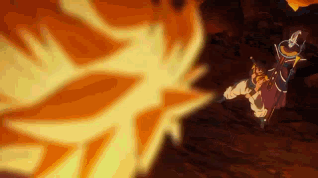 a cartoon character is standing in the middle of a fireball while holding a sword .