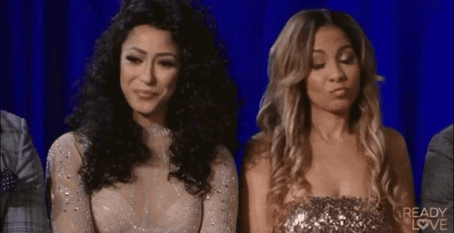 two women are sitting next to each other in front of a blue curtain with the words ready to love on the bottom