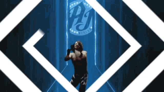 a wrestler is standing in front of a logo that says pj