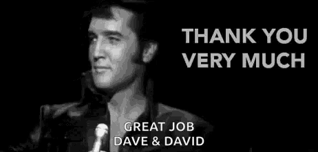 elvis presley is standing in front of a microphone in a black and white photo and says `` thank you very much '' .
