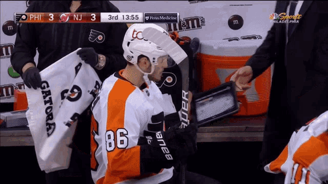 a hockey player with the number 86 on his shirt