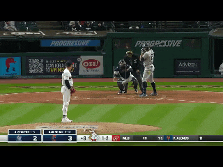 a baseball game is being played in front of a progressive ad