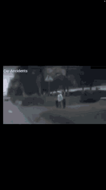 a blurry picture of a person riding a scooter