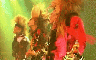 a group of people are playing instruments on a stage .