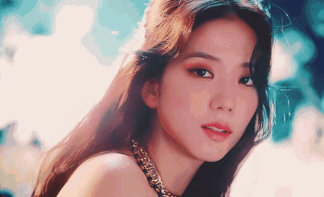 a close up of a woman 's face with long hair