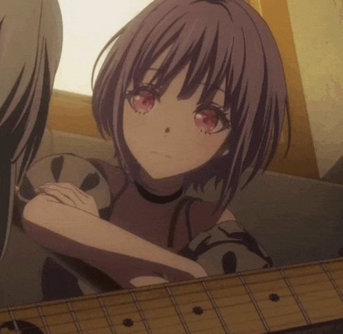 a girl with purple hair and red eyes looks at the camera