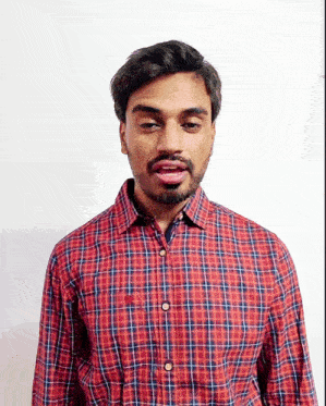 a man wearing a red plaid shirt is talking