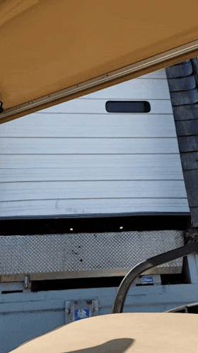 a garage door with a sticker on it that says ' emergency exit ' on it