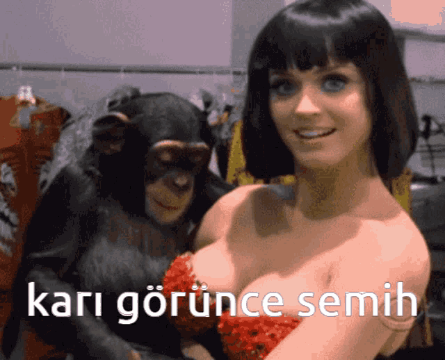 a woman in a red dress is holding a chimpanzee in her arms with the words " kari görünce semih " below her