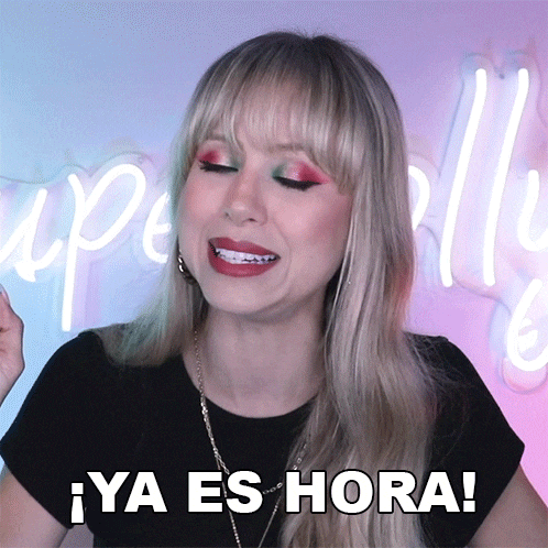 a woman with braces on her teeth is smiling and says ya es hora