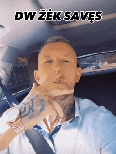 a man smoking a cigarette in a car with dw zek saves above him