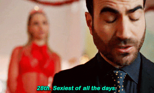 a man in a suit and tie is talking about being the sexiest of all the days