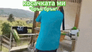 a man in a blue shirt is standing on a balcony with the words kosakata mi written above him .