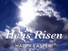 the sun is shining through the clouds and the words `` he is risen happy easter '' are written in the sky .