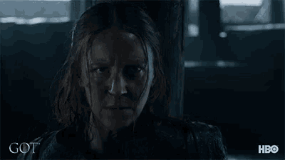a close up of a woman 's face with the word got written on the bottom