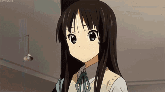 a girl with long black hair and a blue bow tie is looking at the camera with the hashtag gavissa on the bottom right
