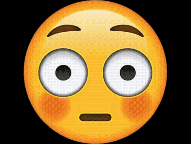 a close up of a yellow smiley face with big white eyes on a black background