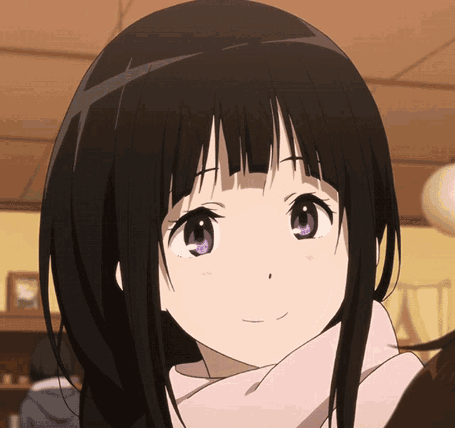 a girl with long black hair and purple eyes is smiling