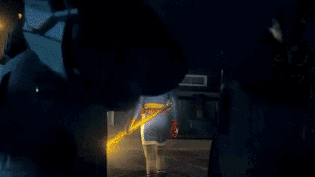 a robot with red eyes and a light on its head