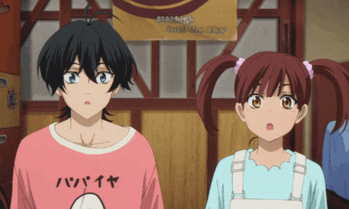 a boy and a girl are standing in front of a sign that says " it 's like a city "