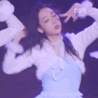 a woman in a blue dress is dancing on stage .