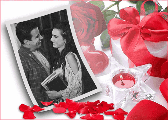 a black and white photo of a man and woman surrounded by red roses