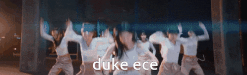 a group of women are dancing with the word duke ece in the corner