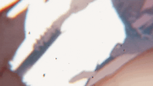 a close up of a person 's face with a blurred background