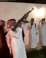 a group of men are holding guns in their hands .