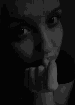a black and white photo of a woman 's face