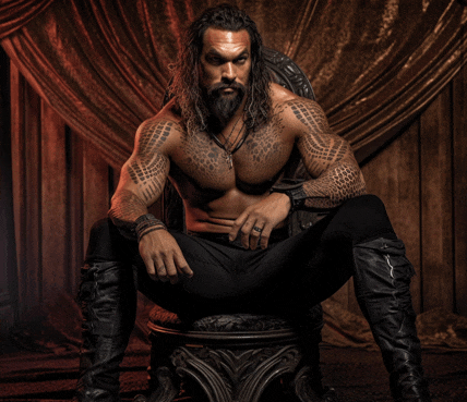 a shirtless man is sitting on a chair with his legs crossed