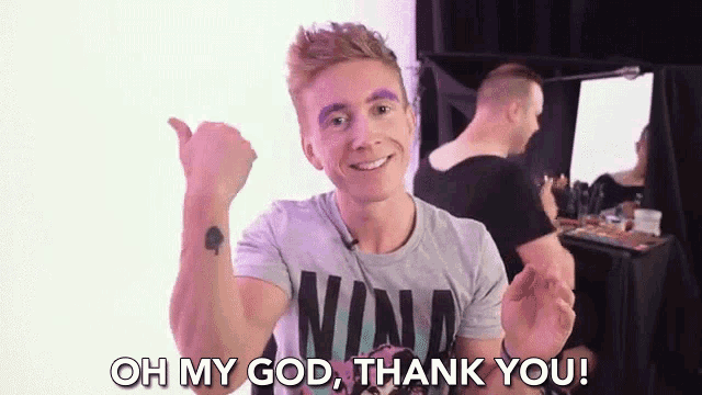 a man is giving a thumbs up and says oh my god thank you .