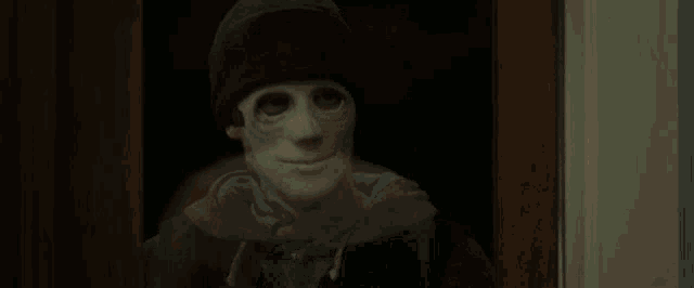 a blurry picture of a woman in a dark room .