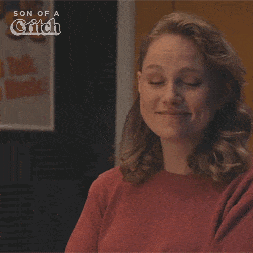 a woman says i did n't ask for it in front of a poster for son of a critch
