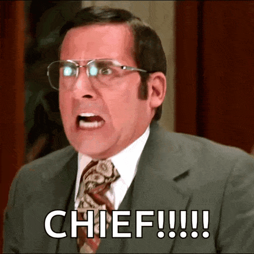 a man in a suit and tie says chief