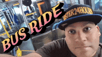 a man wearing a hat that says ' mister 24 hours ' on it