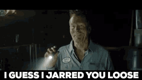 a man holding a flashlight with the words i guess i jarred you loose behind him