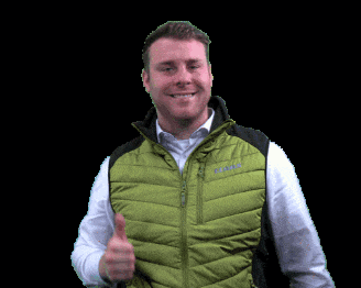 a man wearing a green vest with columbia on it