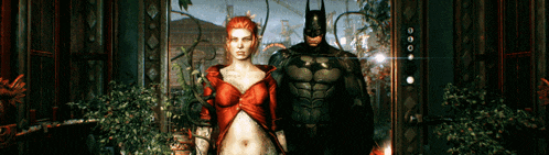 a woman in a red dress is standing next to a man in a bat suit