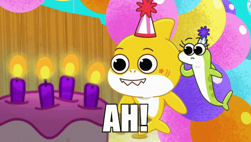 a shark wearing a party hat stands next to a cake with candles