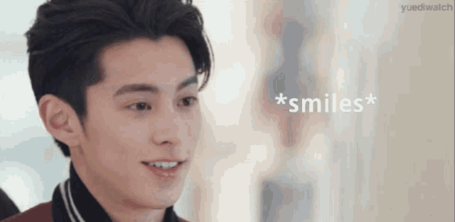 a close up of a man 's face with the words `` * smiles * '' written on the bottom .