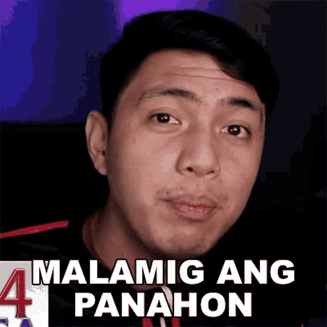 a close up of a man 's face with the words malamig ang panahon written on it .