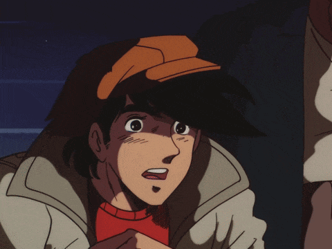 a man in a hat is standing next to a boy in a jacket