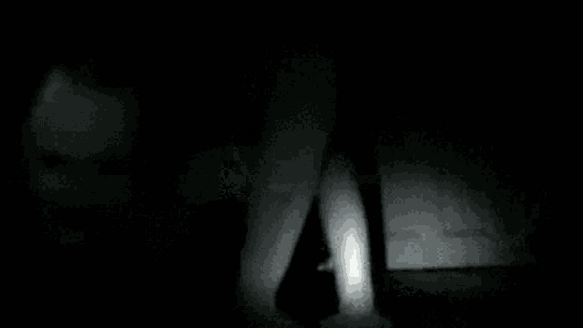 a black and white photo of a person 's eye .