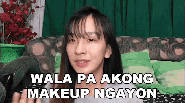 a woman sitting on a couch with the words wala pa akong makeup ngayon written above her