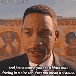 a man in a suit and tie says and just because you see a black man driving in a nice car