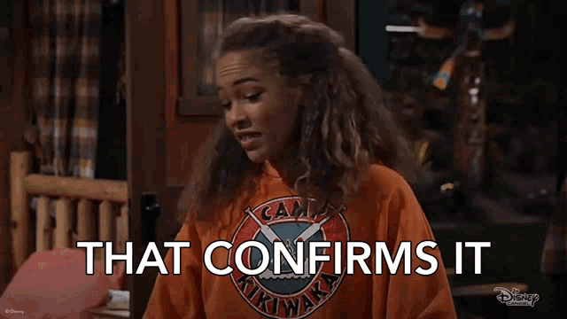 a girl is wearing an orange shirt that says camp arizona